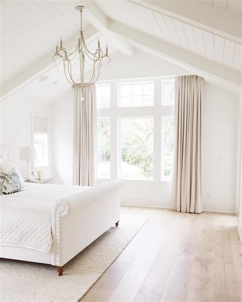 Inspiration for a coastal gray floor, vaulted ceiling and wood wall bedroom remodel in miami with gray walls just an idea for the retreat. 15 Bedroom Chandeliers That Bring Bouts of Romance & Style