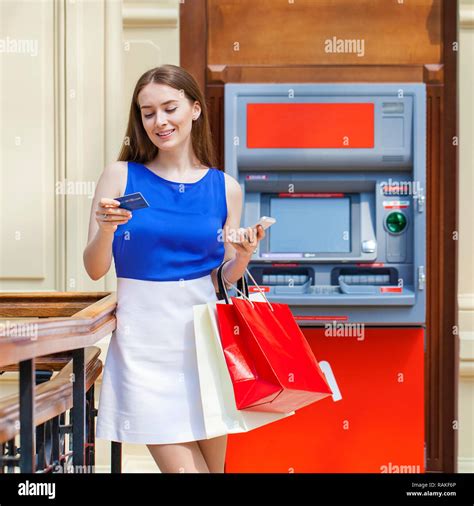 Young Happy Brunette Woman Withdrawing Money From Credit Card At Atm
