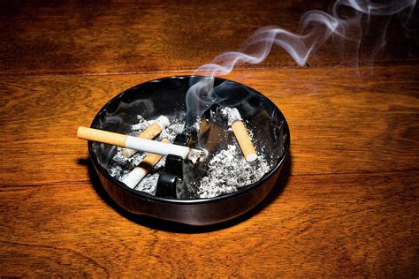 Smoking Cigarette In Ashtray Photograph By Joe Belanger