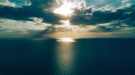Download Wallpaper 3840x2160 Sea Clouds Horizon Light Sun Sunset