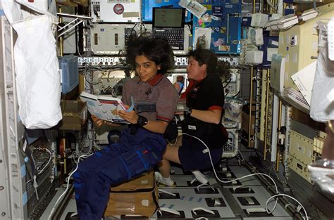 Astronauts Kalpana Chawla And Laurel Clark Sts 107 Mission Specialists Work In The Spacehab
