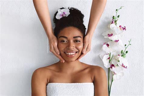 Beautician Making Face Massage For Happy Black Lady Stock Photo Image