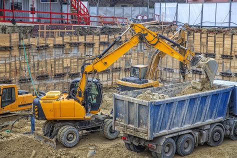 Excavator Is Loading Excavation On The Truck Heavy Construction Equipment Stock Photo Image