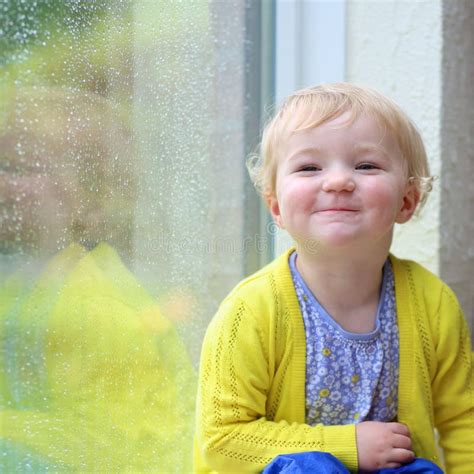 Little Girl Sitting Next Window On Rainy Day Stock Image Image Of