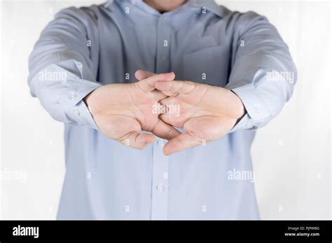 Man Cracking The Knuckles Of His Hands And Fingers Knuckle Cracking Or