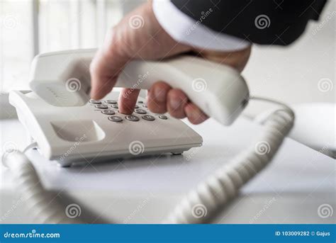 Businessman Dialing A Telephone Number Stock Photo Image Of Line