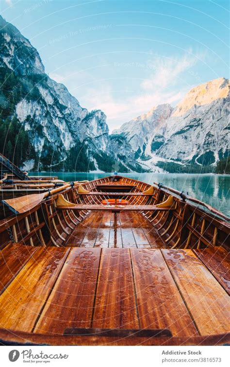 Wooden Boat On Clear Lake In Mountains A Royalty Free Stock Photo