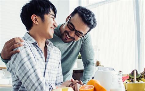 Gay Lgbt Sweet Asian Couple Wearing Pajamas Smiling Looking Each Other Hugging With Happiness