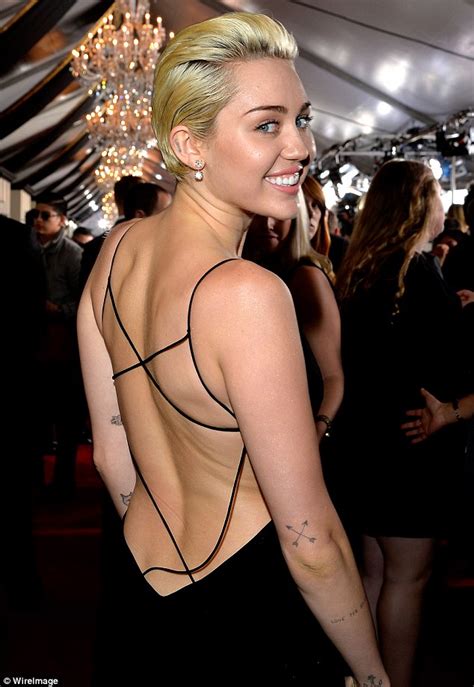 Miley Cyrus Stuns In Backless Black Cut Out Dress At Grammy Awards