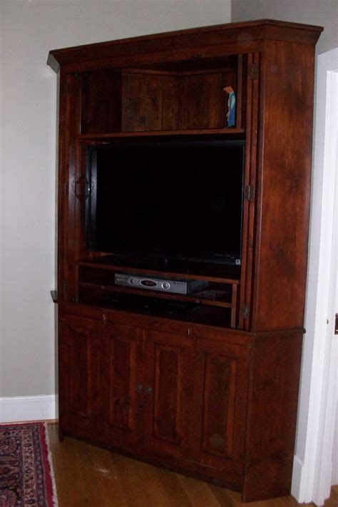 We also offer a variety of small. Large Corner Cabinet with Bi-fold Pocket Doors | Furniture ...