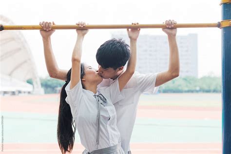 Young Asian College Couple Kissing By Pansfun Images