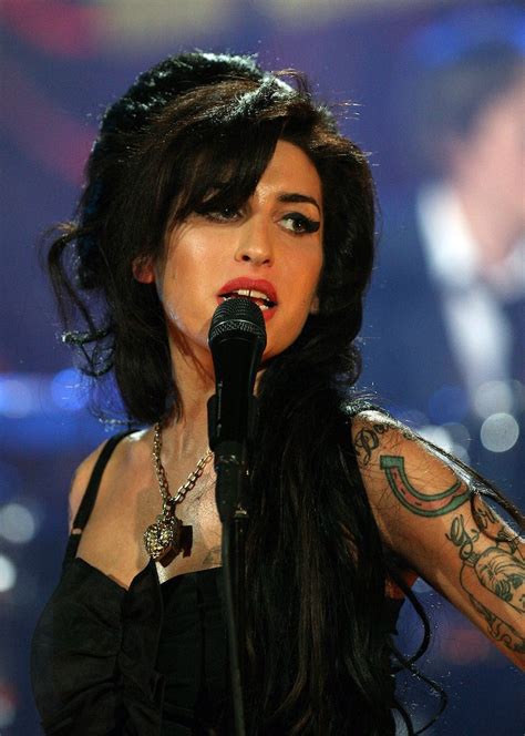 amy winehouse s beehive and eyeliner were as big and beautiful as her voice see 9 of her best combos