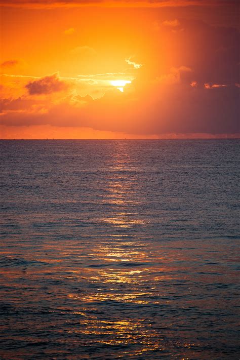 Photo Of Calm Body Of Water During Golden Hour · Free Stock Photo