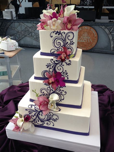 Buttercream Wedding Cake With Scrolling And Fresh Flowers
