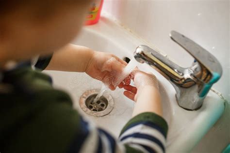 Child Washing Hands In A White Basin With Soap Stock Photo Image Of