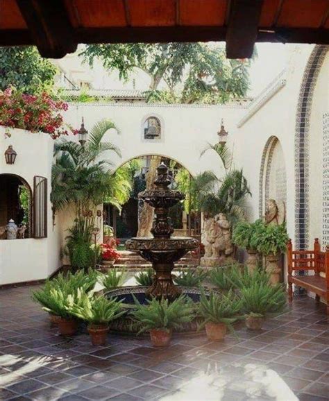 Spanish Courtyard Design With Waterfall Fountain And Pots Spanish