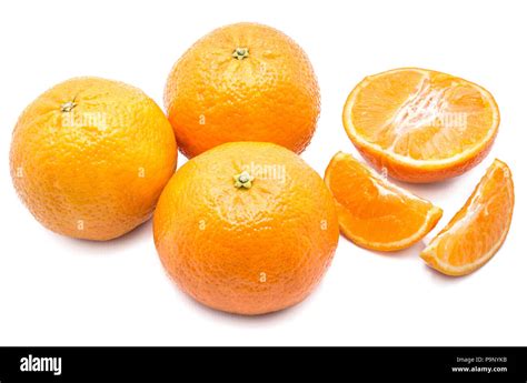 Three Whole Clementines One Half And Two Slices Isolated On White