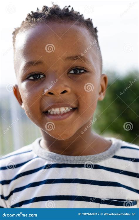 Portrait Of Happy African American Boy On Sunny Terrace Stock Image
