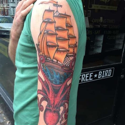 A Man With An Octopus And Ship Tattoo On His Arm