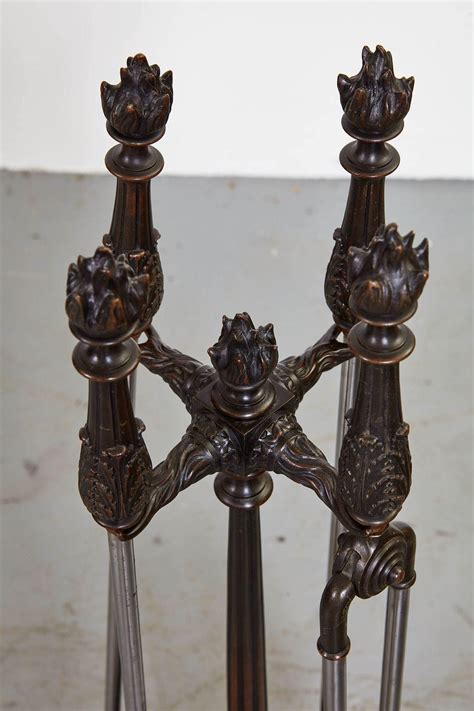 Bronze and Steel Flame Finial Firetools on Stand For Sale at 1stDibs