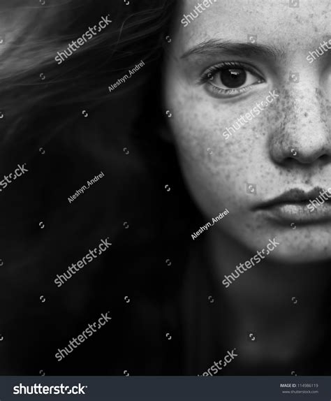 Black And White Portrait Of A Beautiful Girl With Freckles Stock Photo
