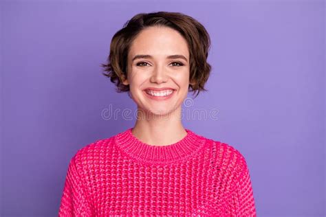 portrait of optimistic cute girl wear pink sweater isolated on violet