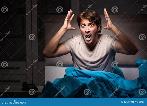 The Young Man Scared In His Bed Having Nightmares Stock Image Image