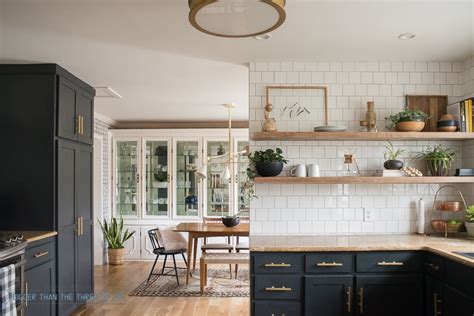 You either lucked out with cupboards that stretch all the way to the ceiling, have open shelving, or this blank spot just hasn't come to your attention yet. Kitchen Reveal with Dark Cabinets and Open Shelving ...