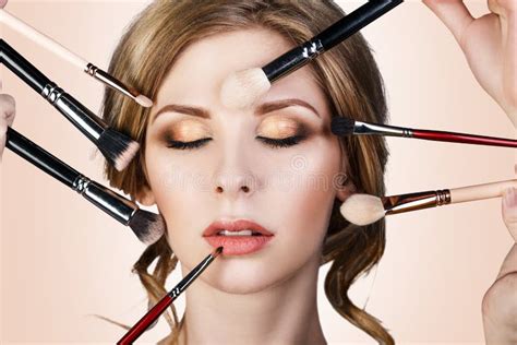 Many Hands Applying Make Up To Glamour Woman Stock Photo Image Of