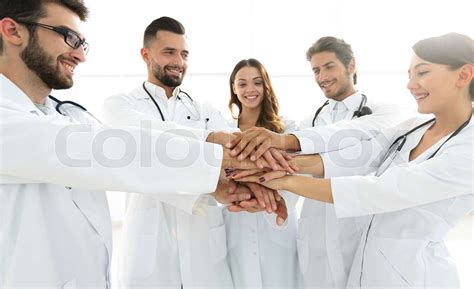 Doctors And Nurses In A Medical Team Stacking Hands Stock Image