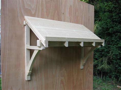 They do require a bit more upkeep. Timber door canopies- traditional cottage canopies - front ...