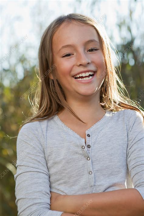 Smiling Girl Standing Outdoors Stock Image F0052650 Science Photo Library