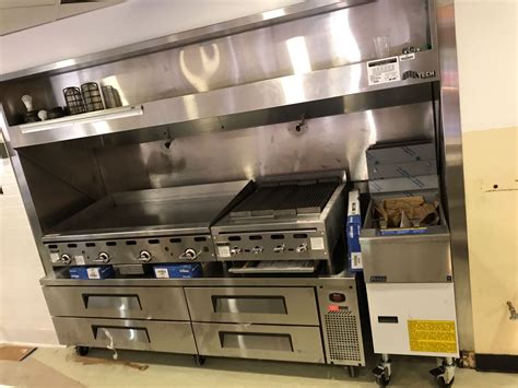 A Commercial Griddle Charbroiler Fryer And Equipment Stand
