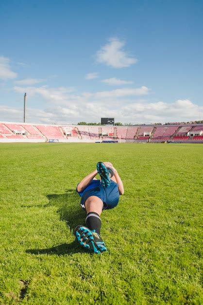 Free Photo Football Player Stretching Legs