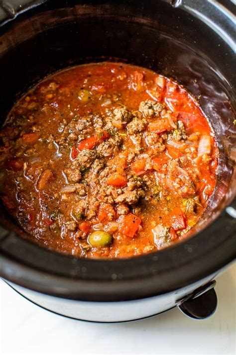 Serve topped with corn chips, shredded cheddar cheese and a dollop of sour cream. Crock Pot Picadillo Is A Filling Healthy Dinner Idea & So ...