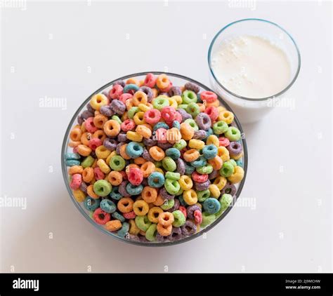 Delicious And Nutritious Fruit Cereal Loops With Milk On White
