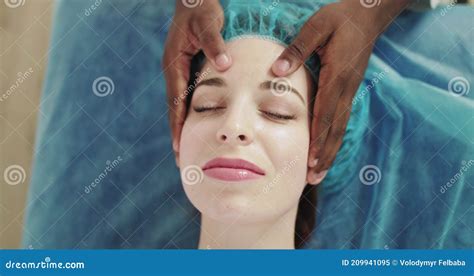 Masseuse Making Head And Face Massage To Her Relaxing And Beautiful