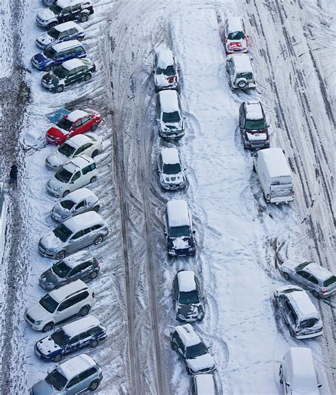 Snow Covered Cars In Parking Lot Photograph By Arctic Images