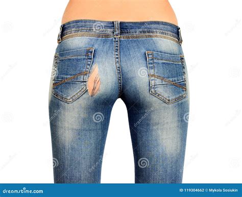 The Back Side Of The Female In Torn Blue Jeans Isolated Stock Photo