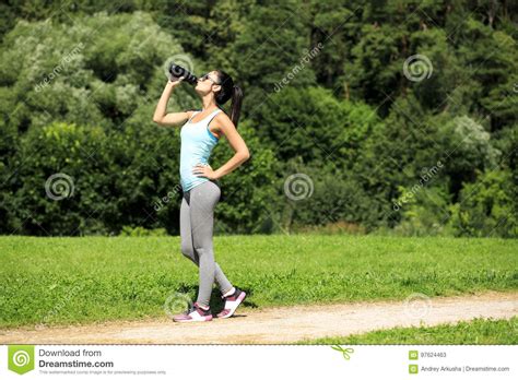 Fitness Woman Drinking Water After Running At Park Stock Image Image