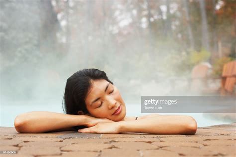 Asian Woman Sitting In Hot Tub High Res Stock Photo Getty Images