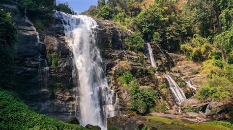 Premium Photo Beautiful Waterfall In Green Vegetation Mountain In