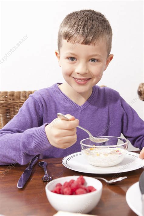Boy Eating Breakfast At Table Stock Image F0058444 Science Photo
