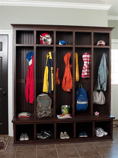 Blue lockers are used as shelving and storage in a boy's bedroom, where the words visitor and home have been placed above two large windows covered with blinds. 17 Best images about Entryway areas on Pinterest | Cubbies ...