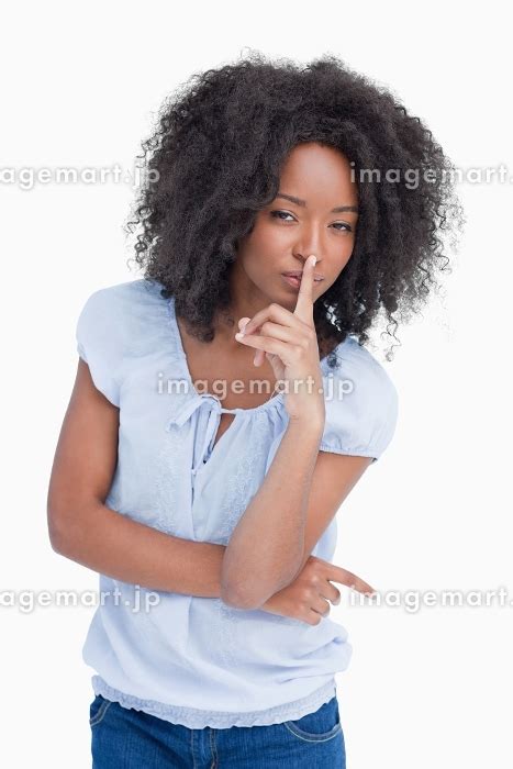 Serious Woman Crossing Arms While Placing Her Finger On Her Mouth