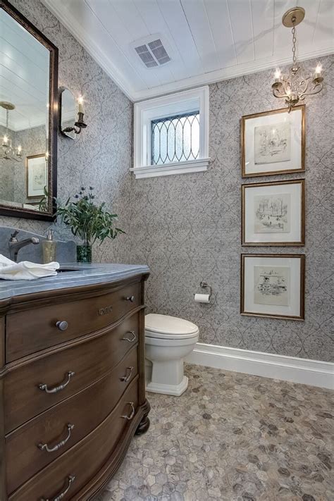 Decorating your half bathroom with a stone tiled wall is a good idea. Cape Cod California Beach House - Home Bunch Interior ...