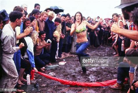 woman running through the mud at the woodstock music festival new news photo getty images