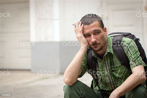 Portrait Of A Lonely Desperate Man Smoking Cigarette Stock Photo