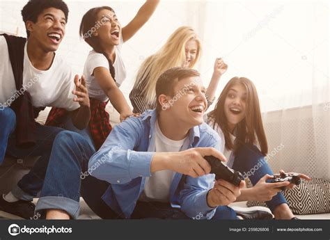 Teenagers Having Fun Playing Video Games Online — Stock Photo © Milkos