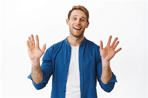 Free Photo Bye Hello Smiling Handsome Young Man Waving Hands And